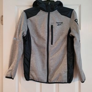 Reebok youth zip-up hooded jacket. Size 14/16.